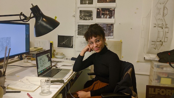 Kayla at her home desk