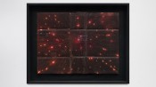 A black frame with a black border with red lights