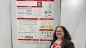 Photo of Professor Michelle Rosen in front of her poster at the IROS Conference.