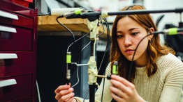 Student calibrating a scientific tool