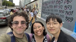 Students in front of Berlin Wall