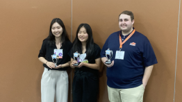 Image of students and their awards.