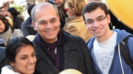 President Bharucha poses with two students