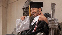 A 2016 graduate enjoys commencement day