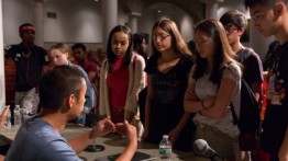 Students talking to Jonathan Chin, co-founder of ShareMeals, after the panel discussion. Photo: João Enxuto