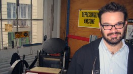 Rich Watts in front of the antique printing press used for ICD labels