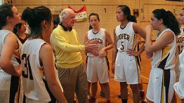 Dean Baker speaks with the women's basketball team