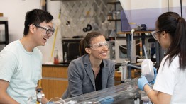 students and professor in a lab