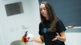 Mary Dwyer demonstrates the SEAL fire-extinguisher, a two-chamber ball that mixes vinegar and baking soda