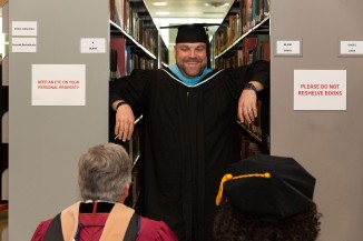 Christopher Chamberlin, dean of students, chats with faculty in the library before heading out to the parade