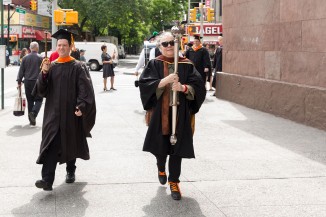 Brian Cusack ME'01, chief marshal, and Day Gleason, mace bearer