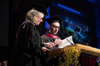 Associate Dean Elizabeth O'Donnell and Dean Nadar Tehrani introduce Jean Brownhill AR'00