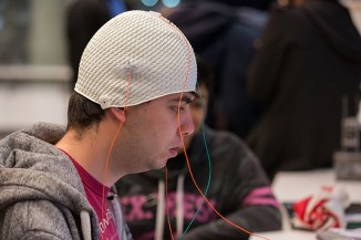 Eric Mendoza-Conner EE'18 engaging with the project "Anima," a computer cursor controlled by brainwavves